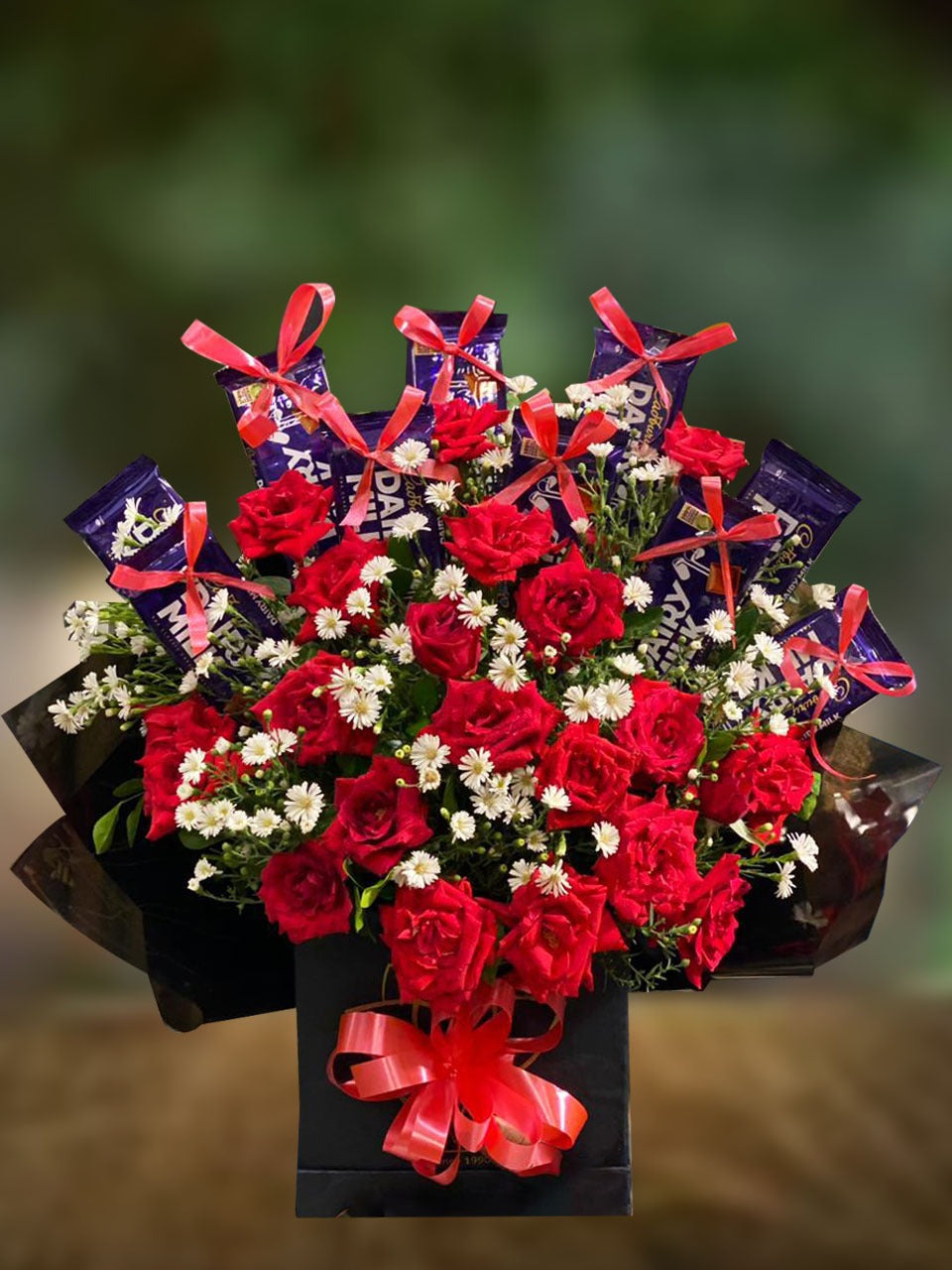 Chocolates and red roses bouquet