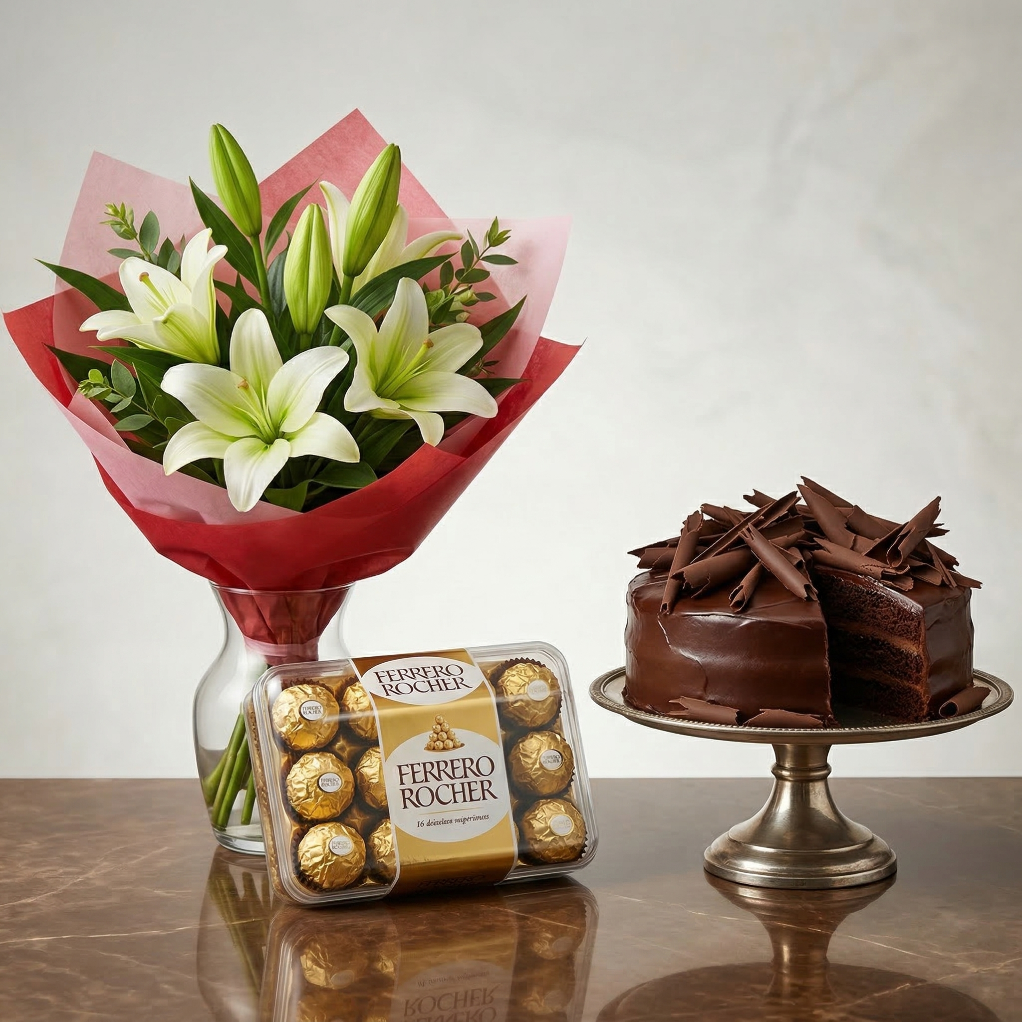 The Golden Elegance Quartet – 4 Imported Lilies, Ferrero Rocher & 5-Star Cake